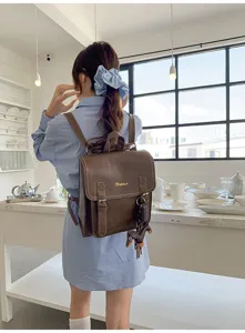 Korean style vintage dark brown leather backpack for women, casual school travel bag.