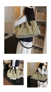 Large capacity travel duffel bag with shoulder strap for sports, gym and short trips.