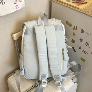 Casual soft backpack for women, light blue daypack with zip pocket for daily shopping.