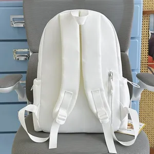 Casual white school backpack for students, lightweight daily daypack with multiple compartments.