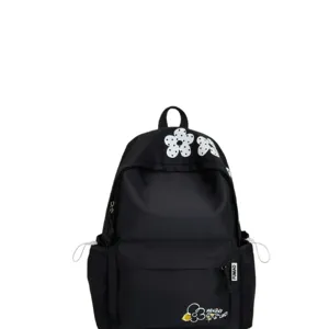Casual black backpack with white dotted flower prints, lightweight school bag with side pockets.