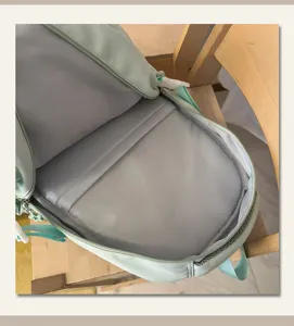 Mint blue school backpack for teenage girls, spacious student bookbag for daily casual travel.