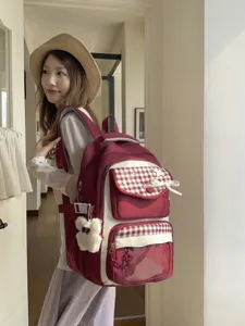 Casual red plaid student backpack with cute bear pendant and large capacity for daily school use.
