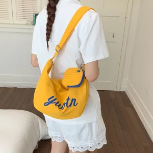 Yellow canvas shoulder bag with blue youth letter print, casual crossbody bag for women daily use.