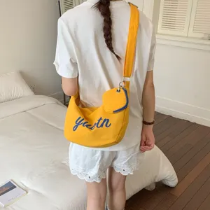Canvas shoulder bag with small pouch, casual yellow crossbody bag for daily streetwear.