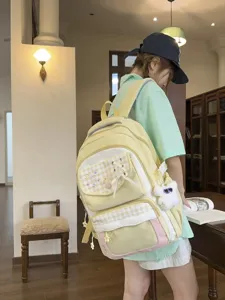 Yellow pink plaid embroidered student school backpack with cute plush pendant and pockets.