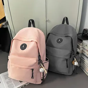 Casual nylon student school backpack with cute baseball charm, stylish minimalist daily bookbag