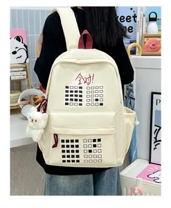 Detailed view of cream student backpack with grid pattern and funny text for daily school use.