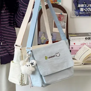 Japanese style cute student canvas shoulder messenger bag with cute pendant and double straps.