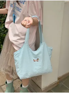 Lichtblauwe schattige tekenfilmhond geborduurde tote tas minimale casual dagelijkse handtas