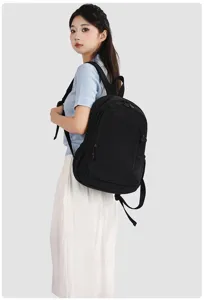Detail view of the black minimalist backpack showing durable zipper and casual style.