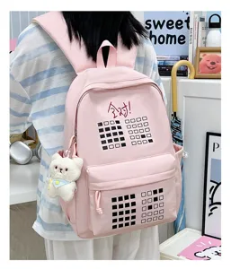 Pink student canvas backpack with cute plush bear pendant, large capacity casual daypack.