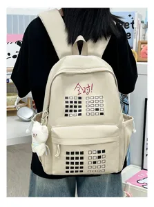 Large capacity beige canvas backpack for students, stylish school bag with cute pendant and print.