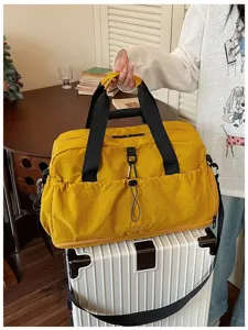 Large capacity travel duffel bag for men and women, casual waterproof gym shoulder bag.