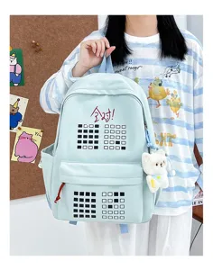 Cute cartoon student school backpack with grid pattern and plush bear pendant for daily use.