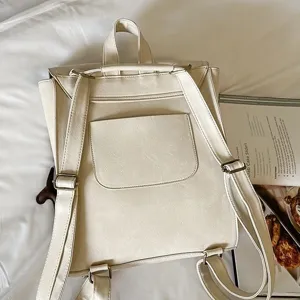 Casual solid color PU leather backpack for women, stylish minimalist daily travel rucksack.
