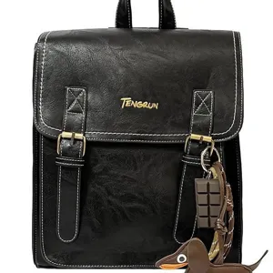 Korean style versatile black PU leather casual backpack with cute charms for daily use.