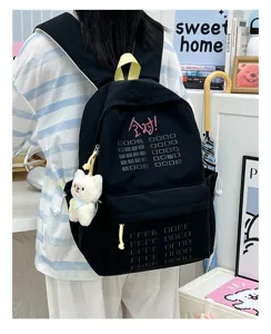 Casual black student backpack with cute bear pendant, large capacity travel school bag.