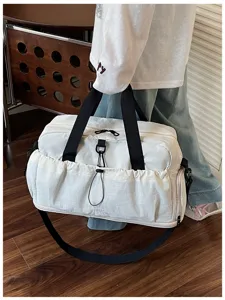 Large capacity travel duffel bag with shoulder strap, casual sports gym bag detail view.