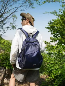 Detailed look at the lightweight outdoor mountaineering backpack in deep blue mesh.
