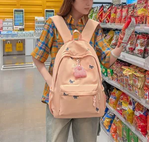 Cute pink canvas backpack with cute embroidery, lightweight and stylish for school.