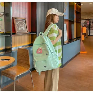 Casual green school backpack with cute embroidery, lightweight design for students daily travel.