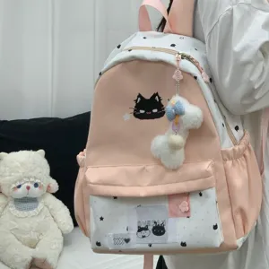 Pink and white cat pattern student backpack with large capacity and cute plush pendant.