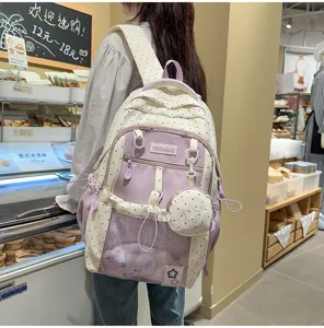 Linda mochila ita de estilo japonés con bolsillo de malla transparente y diseño de lunares.