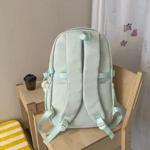 Mint green school backpack for students, casual daily daypack with comfortable shoulder straps.