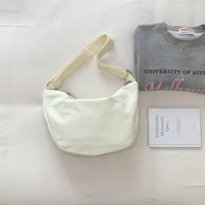 Casual minimalist white shoulder bag and crossbody bag for women daily commute and fashion travel.