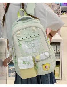 Japanese style light green casual school backpack with cute rabbit design and pockets.