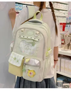 Japanese style sweet light green school backpack with transparent pocket and cute rabbit design.