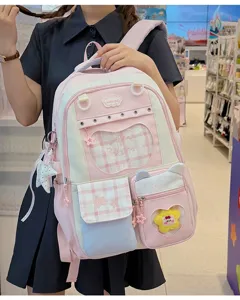 Kawaii pink school backpack for girls with clear window, multi pockets and cute star pendants.