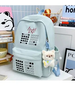 Light blue student backpack with grid pattern and cute bear plush pendant for school travel