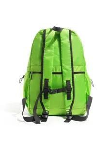 Detail view of the vibrant green lightweight outdoor mountaineering backpack straps and mesh texture.