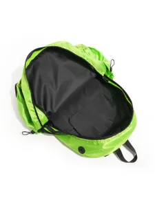 Detailed view of lightweight lime green backpack interior, open compartment design for travel.
