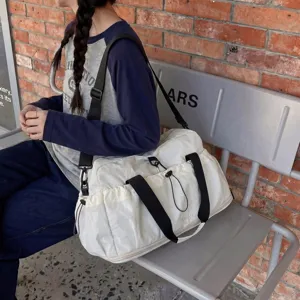 Large capacity white travel duffel bag with shoulder strap for sports, gym and casual daily use.