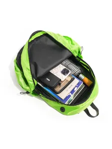 Neon green lightweight mountaineering backpack interior detail showing spacious capacity.
