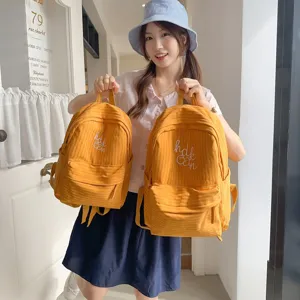 Stylish yellow grid school backpack for daily commuting, casual outdoor travel, and student use.