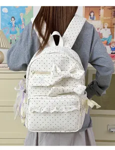 Cute polka dot backpack with double bows and lace trim, sweet style school bag for teen girls.