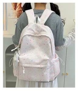 Close up pink star print school backpack detail, cute aesthetic casual daily student bag.