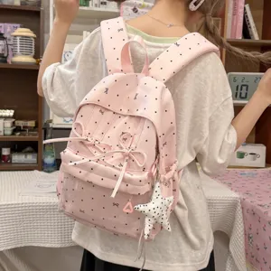 Pink polka dot bow student backpack, cute daily casual school bag with star pendant.