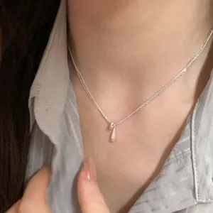 Delicate double layer silver necklace with a minimalist water drop pendant for elegant daily wear.