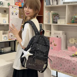 Stylish black polka dot backpack with bow and clear front pocket for daily use and school.
