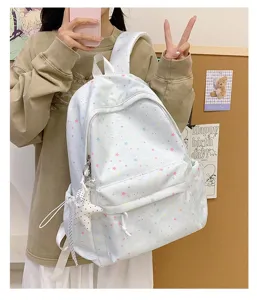 Pastel star print canvas backpack for students, cute casual school bag with star pendant.