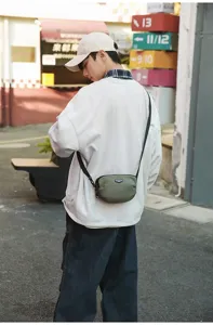 Outdoor small crossbody bag for men and women, stylish nylon shoulder bag for daily commute.