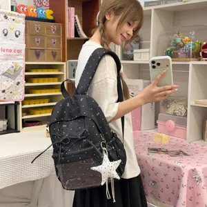 sweet black polka dot backpack with cute bow transparent front pocket and star pendant detail