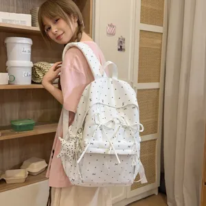 Cute polka dot bow student backpack, stylish sweet daily casual daypack for girls.