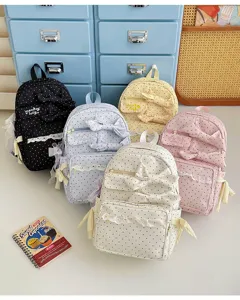 Cute polka dot canvas backpack with sweet bow and delicate lace trim, casual teen school daypack.