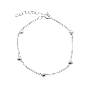 Silver clavicle chain necklace featuring delicate heart pendants for women. Stylish jewelry.